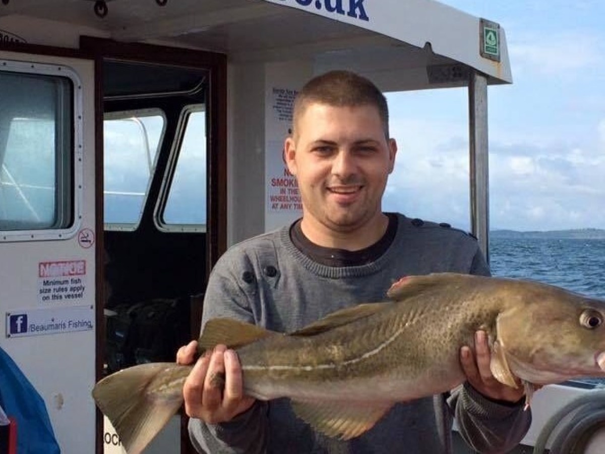 Experienced Angler Wreck man holding fish