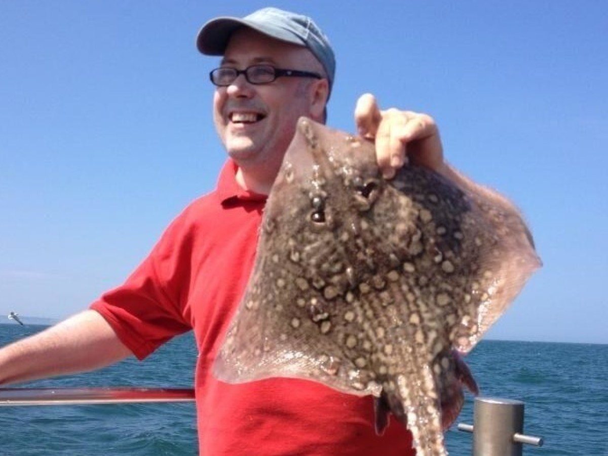 man holding ray