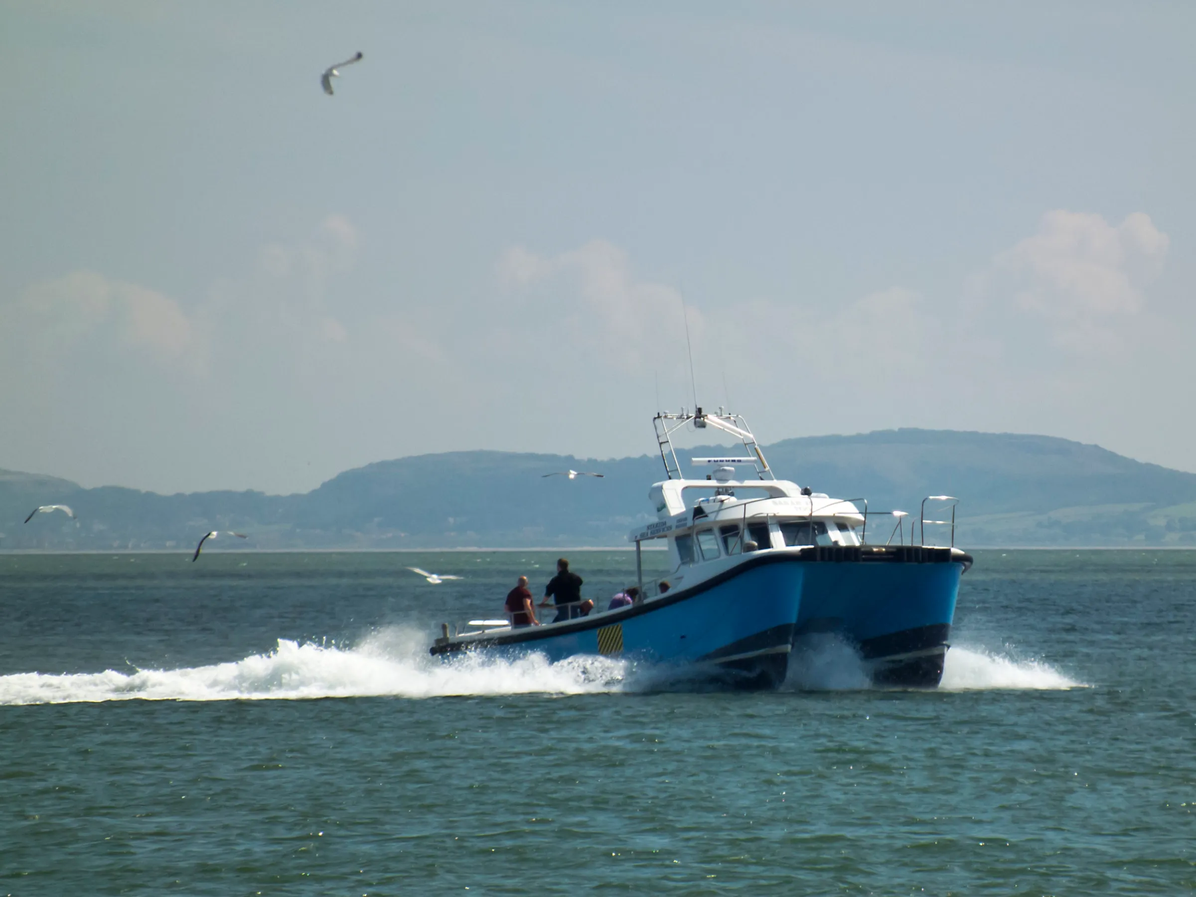a small boat in a large body of water